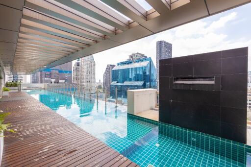 Modern rooftop pool with city skyline view