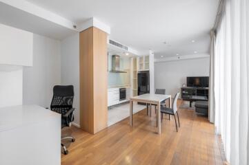 Modern living space with dining area and office corner