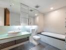 Modern bathroom with glass cabinetry, bathtub, and stylish sink