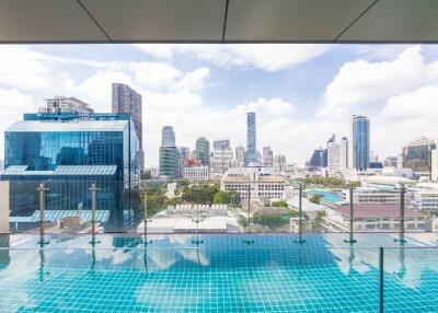 City skyline view from building balcony with pool