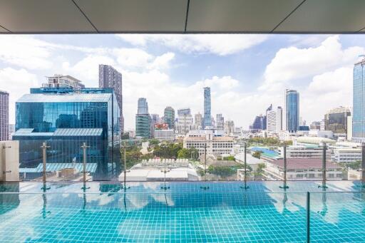 City skyline view from building balcony with pool