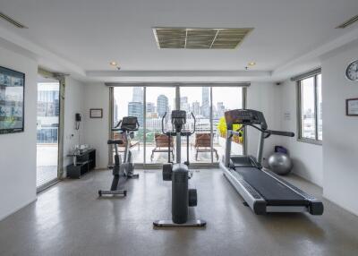 Modern gym with equipment and city views