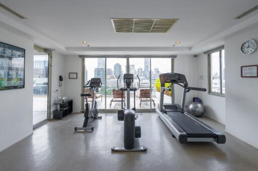 Modern gym with equipment and city views