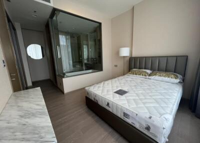 Modern bedroom with a large bed and an attached bathroom