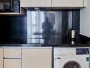 Modern kitchen area with built-in appliances