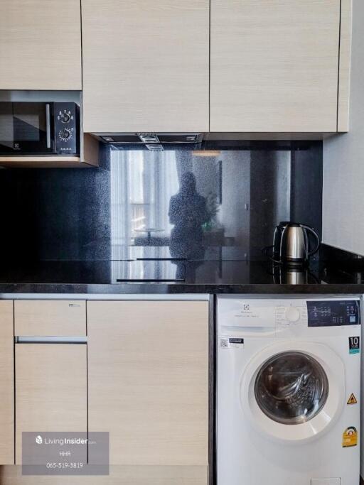 Modern kitchen area with built-in appliances