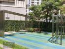 Playground with metal structures including swings and a bench