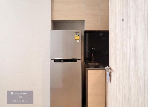 Modern kitchen with built-in refrigerator and cabinet