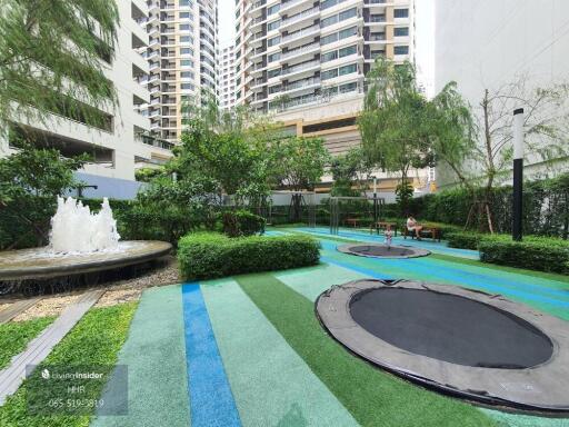 Outdoor recreational space with trampolines and fountain