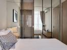 Modern bedroom with mirrored wardrobe doors, bed, checkered cushions, and ambient lighting