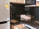 Modern kitchen with stainless steel appliances and black countertop