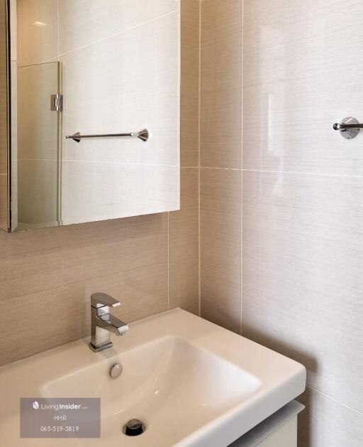 Modern bathroom with sink and mirrored cabinet