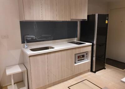 Modern kitchen with dual sinks and stainless steel appliances