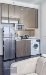 Modern kitchen with appliances and washing machine