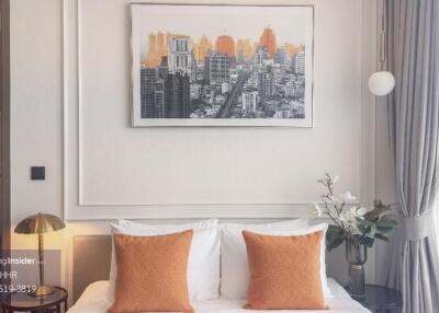 Modern bedroom with cityscape artwork