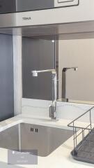 Modern kitchen sink with chrome fixtures