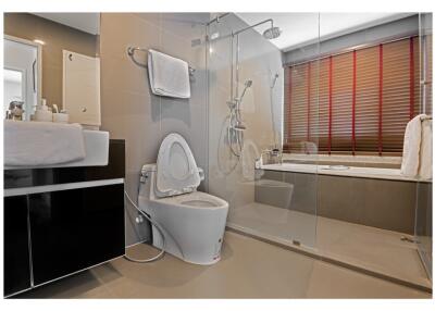 Modern bathroom with glass shower and bathtub