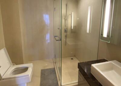 Modern bathroom with glass shower enclosure and vanity