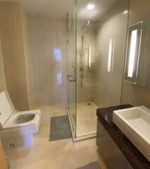 Modern bathroom with glass shower enclosure and vanity