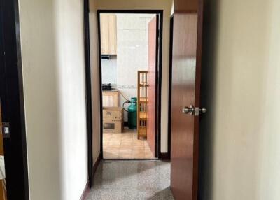 View of a hallway leading to a kitchen area