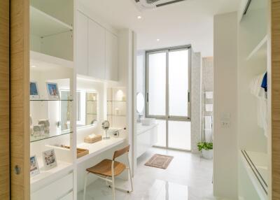 Spacious and modern bathroom with vanity and large window