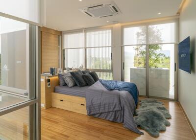 Modern bedroom with natural light and stylish decor