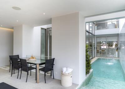 Modern patio with dining area and small pool