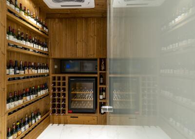 Spacious wine cellar with wooden shelves and climate control