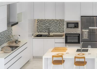 Modern kitchen with white cabinetry and appliances