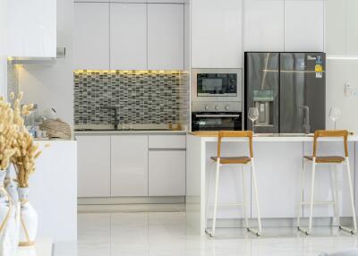 Modern kitchen with island and bar stools