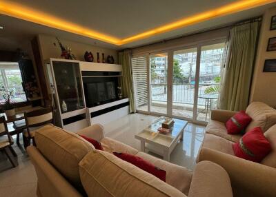 Spacious living room with modern decor and natural light