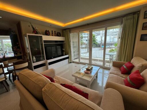 Spacious living room with modern decor and natural light