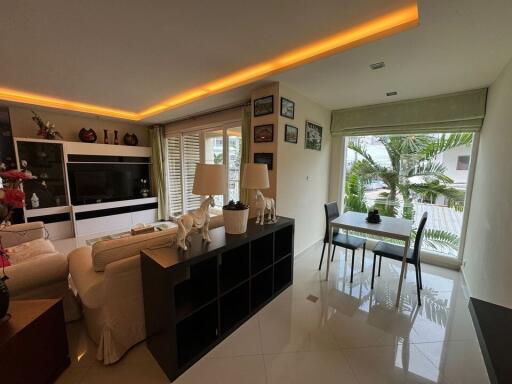 Modern living room with large windows and natural light