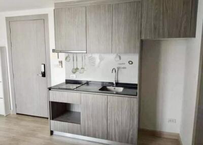 compact modern kitchen with wooden cabinets