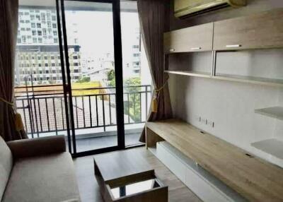 Modern living room with balcony and built-in shelves