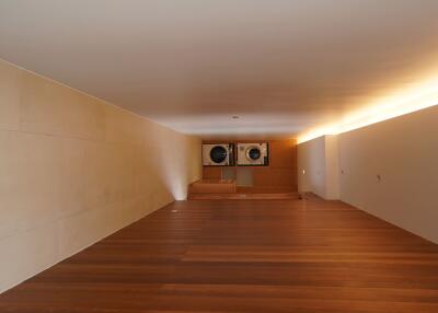 Spacious laundry room with built-in washer and dryer