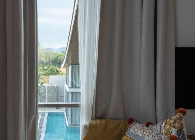 Cozy bedroom corner with pool view