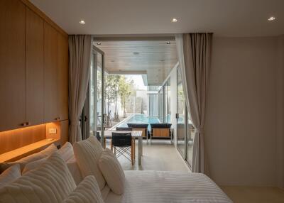 Modern bedroom with poolside view