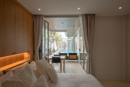 Modern bedroom with poolside view