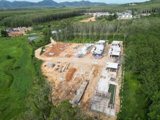 Photo of a construction site with ongoing building activities