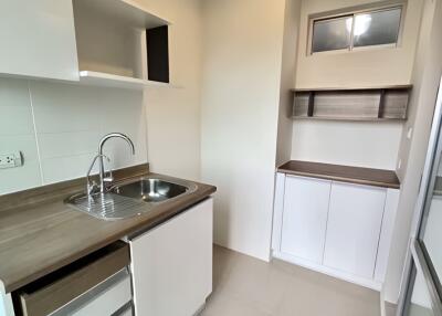 Modern kitchen with sleek cabinetry and stainless steel sink