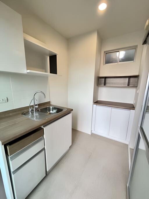 Modern kitchen with sleek cabinetry and stainless steel sink