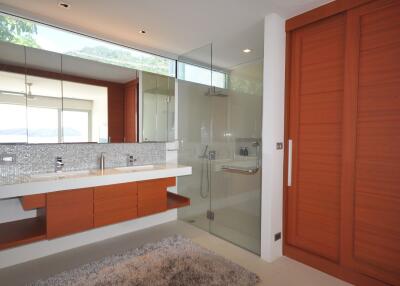 Modern bathroom with glass shower and double sink