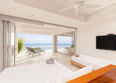 Bright minimalistic bedroom with ocean view