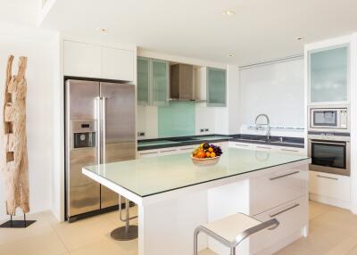 Modern kitchen with stainless steel appliances and an island