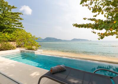 Outdoor pool area with ocean view