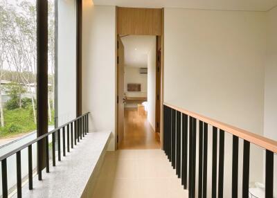 Modern hallway with large window and view to living space