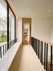 Modern hallway with large window and view to living space