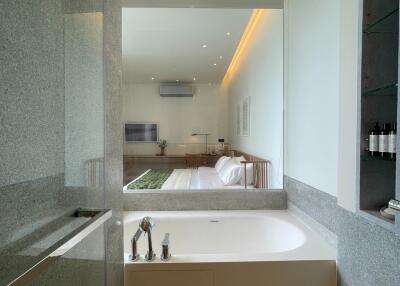 Modern bathroom with a view of the living area