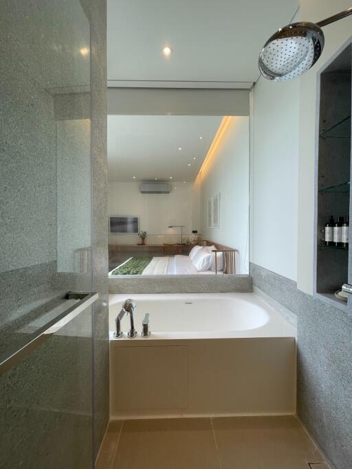 Modern bathroom with a view of the living area